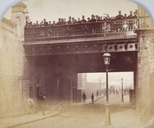 View of figures looking over the south side of Shoe Lane Bridge, City of London, 1869. Artist: Henry Dixon