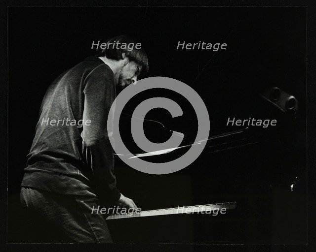 Michael Garrick on the piano at The Stables, Wavendon, Buckinghamshire. Artist: Denis Williams