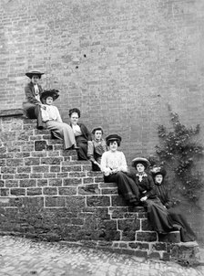 Women sitting on steps of an unidentified building, Hellidon, Northamptonshire, c1896-c1920. Artist: Alfred Newton & Sons.