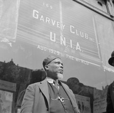A follower of the late Marcus Garvey who started the "Back to Africa" movement, New York, 1943. Creator: Gordon Parks.