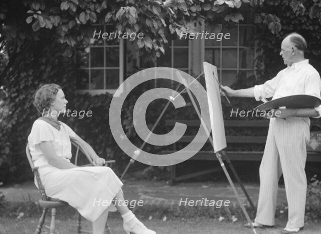 Mr. Hamilton King painting Mrs. Hamilton's portrait outdoors, between 1934 and 1942. Creator: Arnold Genthe.