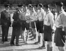 Introductions before a RAF vs Metropolitan Police football match, Wembley, London, 1942. Artist: Unknown