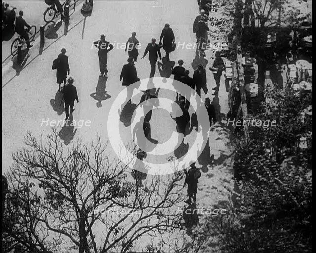 People Walking Around a Pavement, 1933. Creator: British Pathe Ltd.