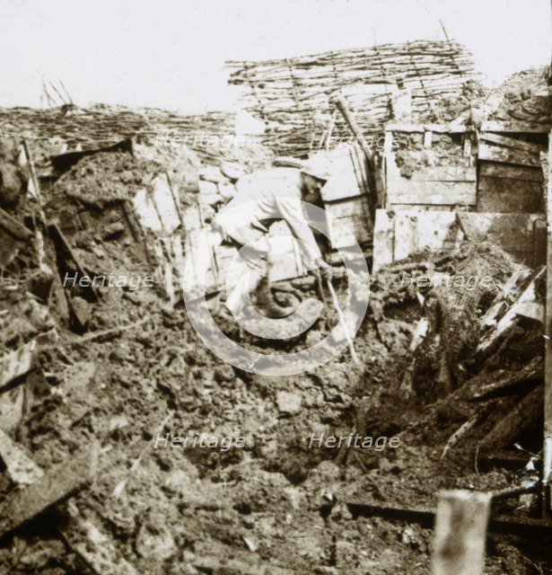 Aftermath of a shell, a soldier in the crater, c1914-c1918. Artist: Unknown.