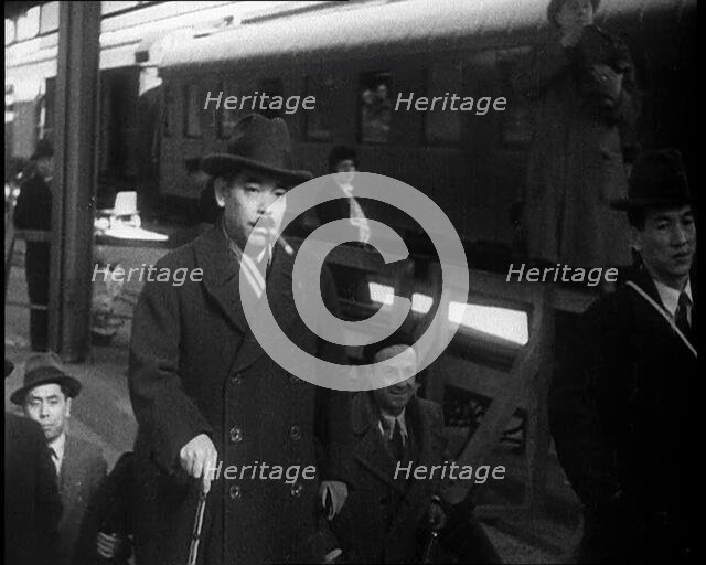 Japanese League of Nations Delegates Entering a Train Station, 1933. Creator: British Pathe Ltd.