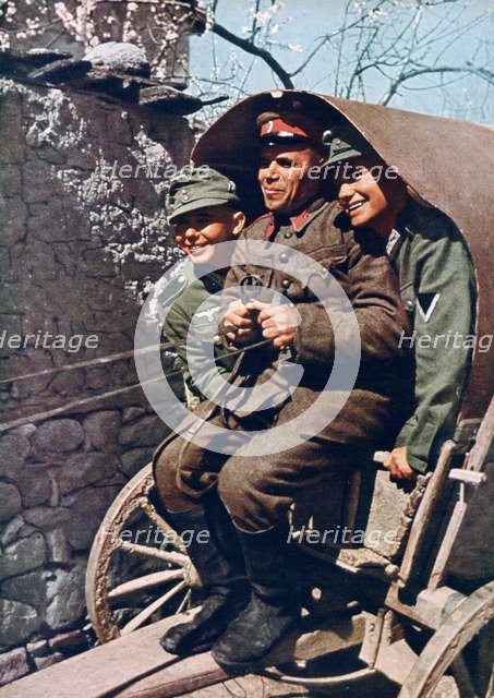 German alpine troops in a cart with a Bulgarian soldier, Struma Valley, Bulgaria, 1941. Artist: Unknown
