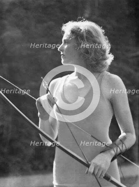 Chase, Diana, Miss, doing archery, 1933 June 22. Creator: Arnold Genthe.