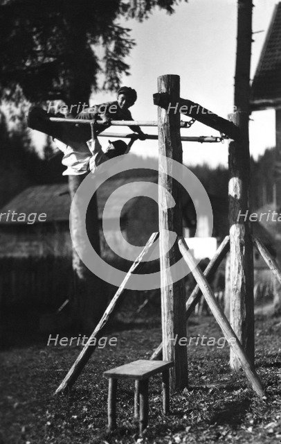 Children playing on a climbing frame, Bistrita Valley, Moldavia, north-east Romania, c1920-c1945. Artist: Adolph Chevalier