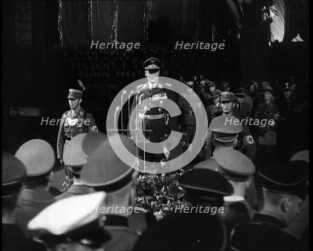 Hermann Goering Standing Before Microphones on a Decorated Dais...,1937 Creator: British Pathe Ltd.