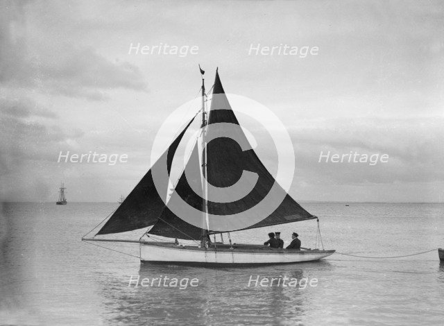 Small cutter sailing,1912. Creator: Kirk & Sons of Cowes.