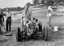 Raymond Mays with his ERA at Brooklands, Surrey, 1936. Artist: Bill Brunell.