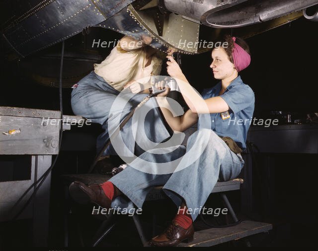 Women at work on bomber, Douglas Aircraft Company, Long Beach, Calif., 1942. Creator: Alfred T Palmer.