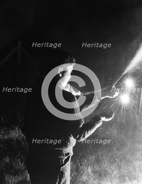 Children with fireworks, c1955. Creator: Arthur Charles Kirby Ware.
