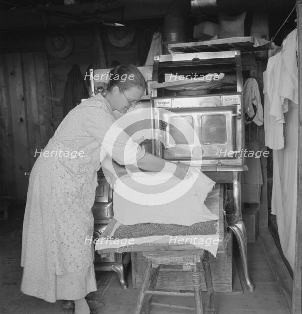 Mrs. Hull drying corn, Dead Ox Flat, Malheur County, Oregon, 1939. Creator: Dorothea Lange.