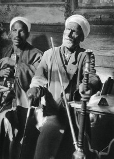 Smoking the narghileh, Cairo, 1937. Artist: Martin Hurlimann