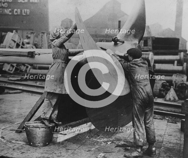 Women working on propeller, Eng. [i.e. England], between c1915 and 1917. Creator: Bain News Service.