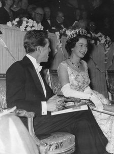Queen Elizabeth II and Lord Snowdon joke at the premiere of West Side Story, London, 1962. Artist: Unknown