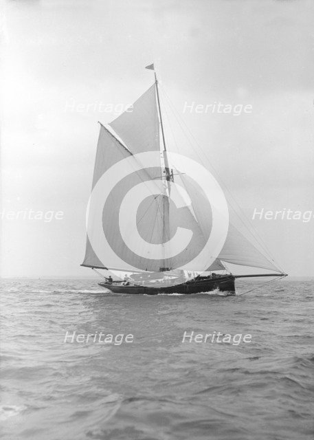 The cutter 'Vanity' sailing close-hauled, 1913. Creator: Kirk & Sons of Cowes.