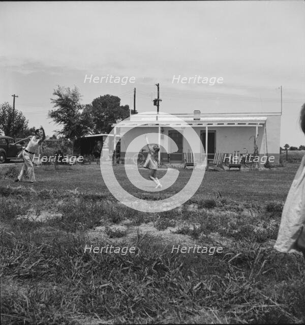 Sunday morning on the Baxter part-time farms project, Arizona, 1938. Creator: Dorothea Lange.