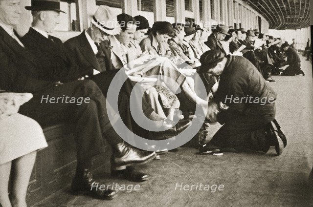 Shoe shiners working on board the Staten Island Ferry, New York, USA, c1920s-c1930s. Artist: Unknown