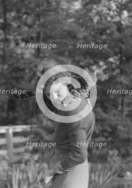 Le Gallienne, Eva, with cat, outdoors, 1937 Creator: Arnold Genthe.