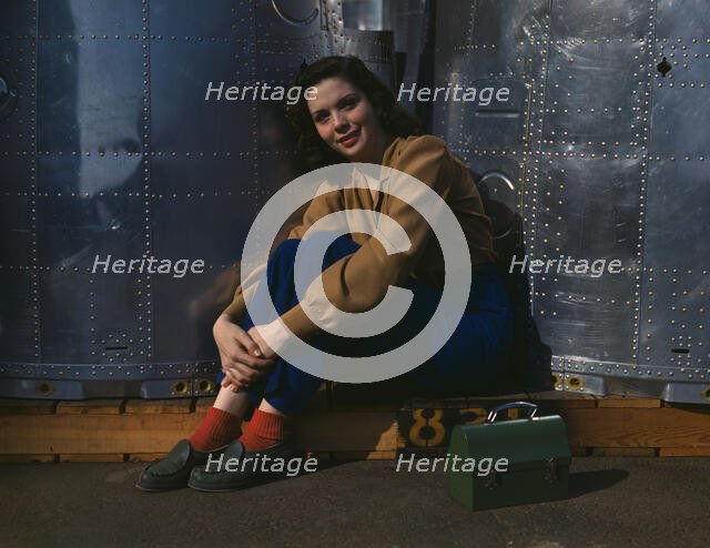 A noontime rest for a full-fledged assembly worker...Long Beach, Calif. Plant of Douglas..., 1942. Creator: Alfred T Palmer.