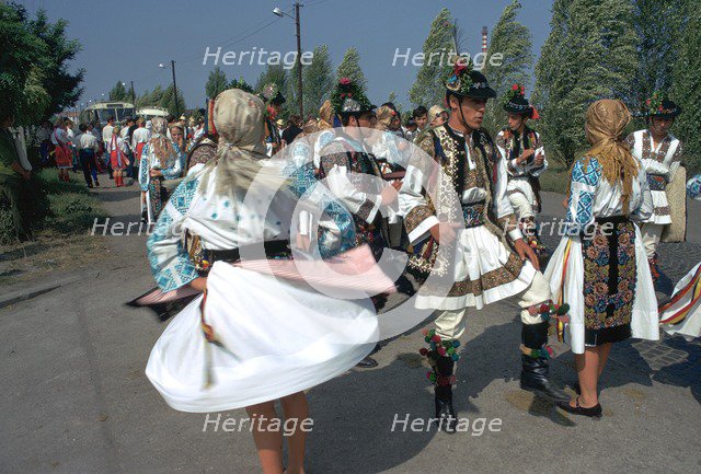 Dancers at a Hungarian folklore festival. Artist: CM Dixon Artist: Unknown