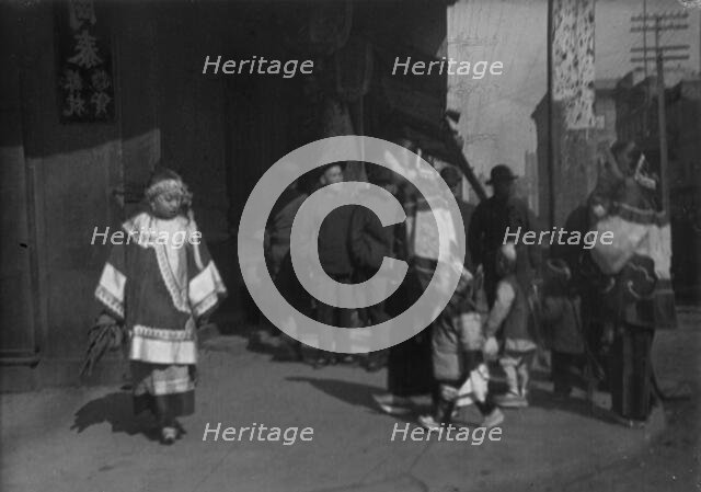 Women and children walking down a street, Chinatown, San Francisco, between 1896 and 1906. Creator: Arnold Genthe.