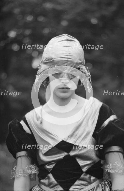 Cutter, Helen, Miss, wearing a mask, 1921 or 1922. Creator: Arnold Genthe.