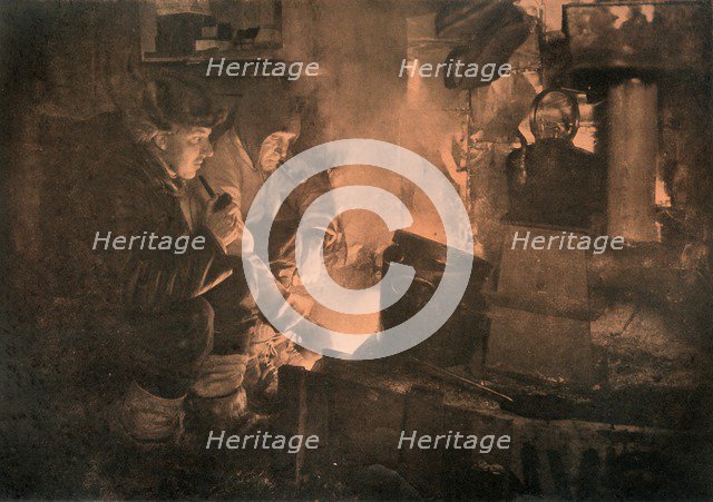 'Oates and Meares at the Blubber-Stove in the Stables', 1911, (1913). Artist: Herbert Ponting.