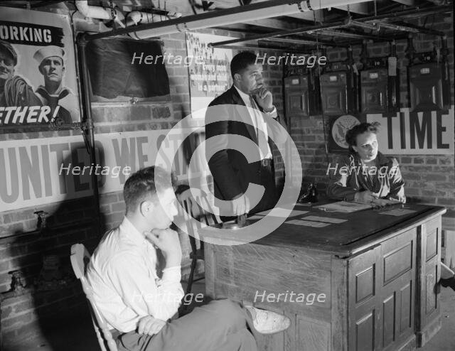 Air raid wardens' meeting in zone nine, Southwest area, Washington, D.C, 1942. Creator: Gordon Parks.