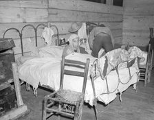 Sick Negro in the Red Cross temporary infirmary for flood refugees, Forrest City, Arkansas, 1937. Creator: Walker Evans.
