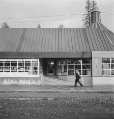 Stores and community center in model lumber company town, Gilchrist, Oregon, 1939. Creator: Dorothea Lange.