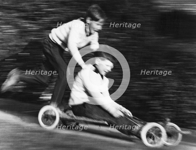 Boys playing with a home-made go-kart, Horley, Surrey, 1965.