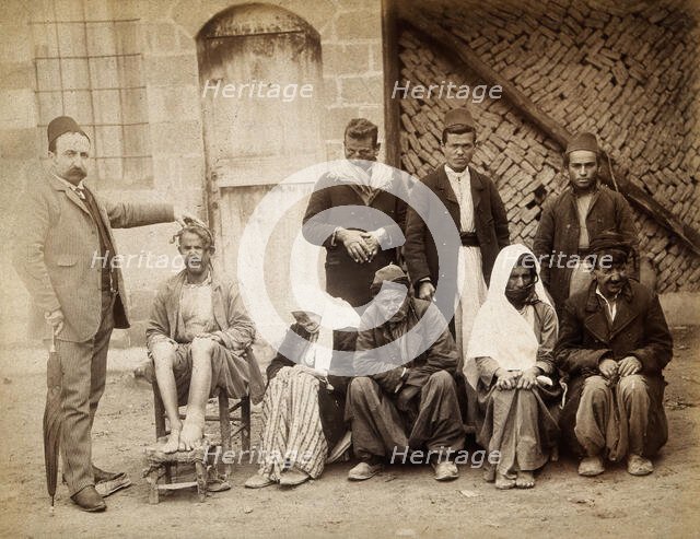 A group of people with leprosy in Jerusalem: a man in a striped suit..., c1890s. Creator: Unknown.
