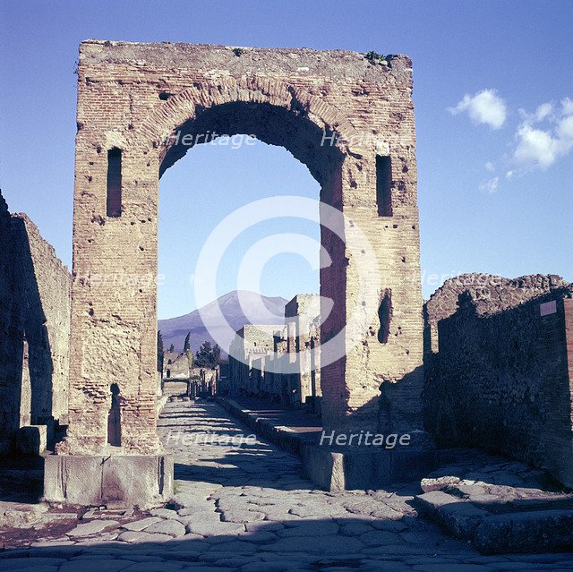 Arch of Caligula with Vesuvius beyond, Pompeii, Italy. Creator: Unknown.