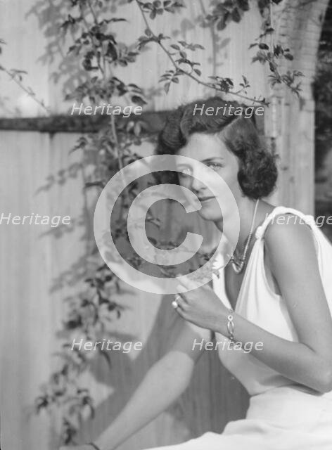 Kramer, A.L., Mrs. (Alice Bishop), seated outdoors, 1932 Creator: Arnold Genthe.