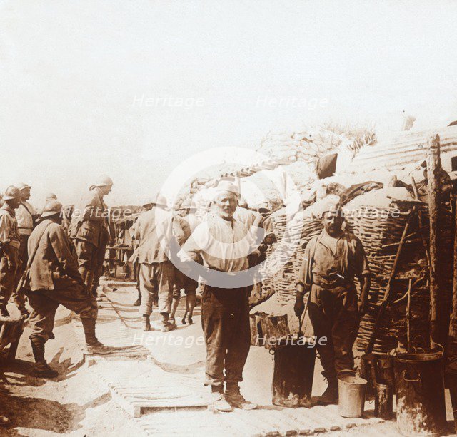 Soldiers with metal containers, c1914-c1918. Artist: Unknown.