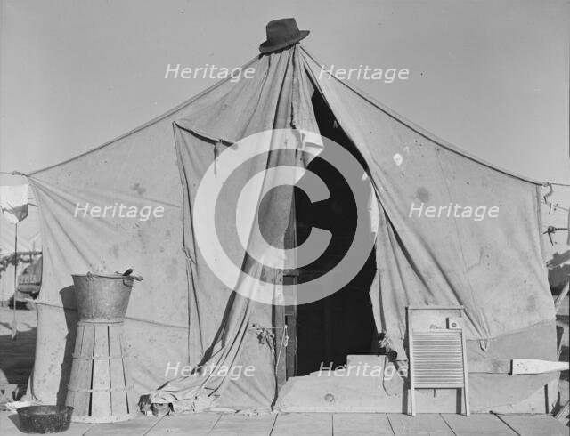 One of a row of tents, home of a pea picker, near Calipatria, Imperial Valley, California, 1939. Creator: Dorothea Lange.