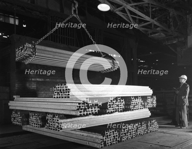 Steel 'H' girders being stacked for distribution, Park Gate, Rotherham, South Yorkshire, 1964. Artist: Michael Walters