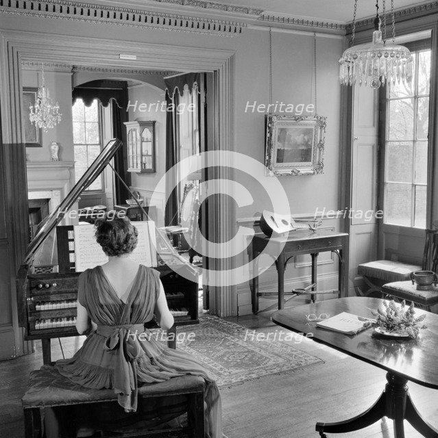 Woman in evening dress playing the harpsichord, Fenton House, London, 1960-1965. Artist: John Gay