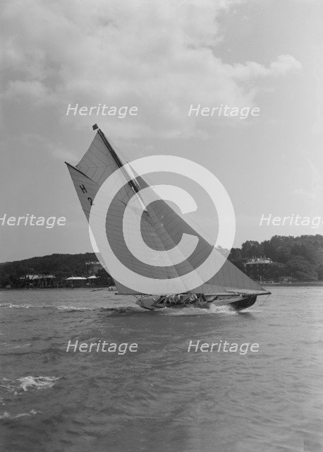 'Verbena' (H2), a gaff rig 8 Metre, sailing close-hauled, 1911. Creator: Kirk & Sons of Cowes.