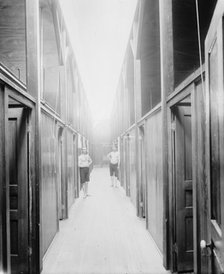 Two men in corridor, probably the Ypsilanti mineral bath house, Ypsilanti, Michigan, c1900-1910. Creator: Unknown.