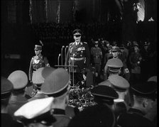 Hermann Goering Standing Before Microphones on a Decorated Dais...,1937 Creator: British Pathe Ltd.