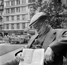 An elderly man asleep with his newspaper, City of London, c1946-c1959. Artist: John Gay
