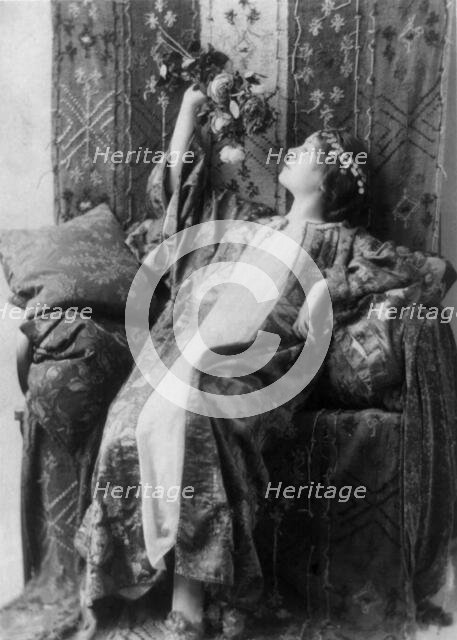 Neith Boyce Hapgood, full-length portrait, seated, left profile, wearing..., between 1890 and 1910. Creator: Frances Benjamin Johnston.