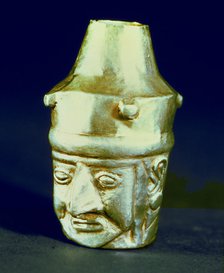 Anthropomorphic head shaped vase, made of silver and representing a hook-nosed person.