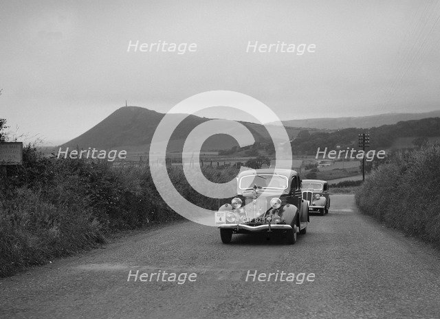 Ford V8 saloon of HJ Parsons competing in the South Wales Auto Club Welsh Rally, 1937 Artist: Bill Brunell.