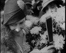 Elizabeth, Her Majesty the Queen of the Belgians Receiving Flowers, 1930s. Creator: British Pathe Ltd.