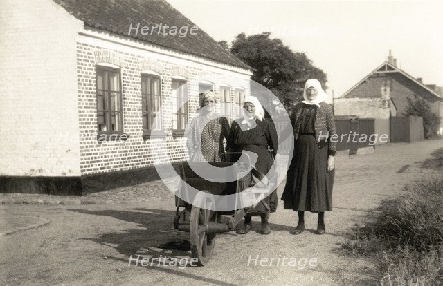Three women on their way to town to sell fish their husbands have caught, Landskrona, Sweden. Artist: Unknown